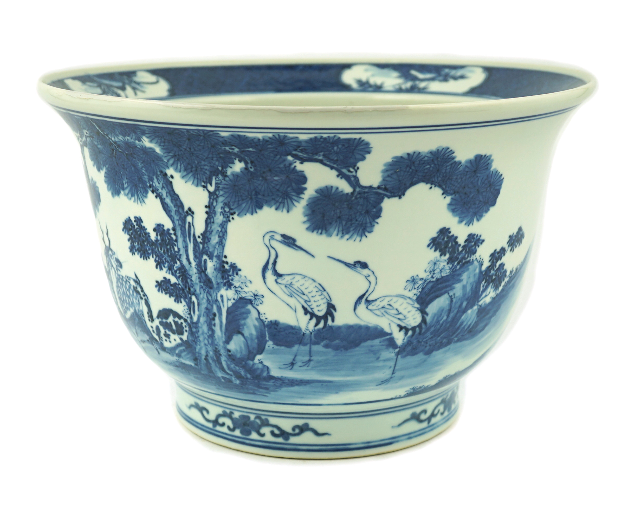 A Chinese blue and white 'deer and cranes' planter, 19th century, restoration to rim and a crack to the base